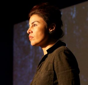 Dena Al-Adeeb is an artist, writer and activist born in Baghdad, Iraq and is currently based in New York. Dena is a Ph.D. candidate in the Middle Eastern and Islamic Studies Department, Culture and Representation track with a focus in Arts Politics at New York University. Dena is also an Adjunct Faculty in the Department of Media, Culture and Communication at NYU and a Visiting Instructor in the Humanities and Media Studies Department and Pratt School of Architecture at the Pratt Institute. Her work has been published in Alif: Journal of Comparative Poetics, The Color of Violence Anthology, Arab and Arab American Feminisms: Gender, Violence and Belonging, We Are Iraqis: Aesthetics and Politics in a Time of War Anthology, Encyclopedia of Women and Islamic Cultures, Contemporary Practices Journal, Art Dubai Journal, Kritiker Literary Journal, Hysterical Feminisms Periodical, Contact Sheet, Light Work Annual 2011, among others. Dena’s work has been exhibited at the Worth Ryder Gallery at the University of California-Berkeley, Arab American National Museum, Museum of Latin American Art, Light Work Gallery, Art 13: London: Modern and Contemporary Art Fair, Headlands Center for the Arts, MECA at Mana Contemporary and Lelia Heller Gallery, The National Veterans Art Museum, Örebro International Videoart Festival, Darb 1718, Falaki Gallery, Mashrabia Gallery, Espcase Karim Francis Gallery, Bastakiya Art Fair, Galerie le Violon Bleu, Pro-Arts Gallery, among others. Dena has been a resident artist at Light Work and Mana Contemporary in New York. Research Interests: Postcolonial Studies, Visual Culture, Media/Cultural Studies, Contemporary Art, Architecture, Archeology and Cultural Heritage, Women and Gender Studies, Memory and Trauma Studies, Performance Studies, Ethnic Studies, Transnationalism, Diaspora and Displacement, Mourning and Remembrance, Imperialism, Urban Politics, War Studies; Iraq War, ‘Ashura, Sacred Spaces, Death and Dying Rituals.